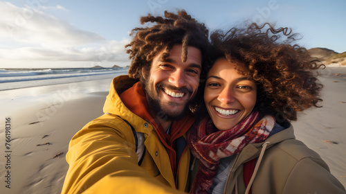 happy smiling couple taking selfie at the beach with smiling faces