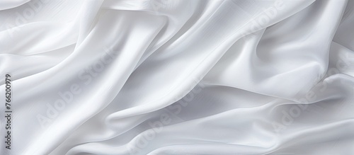 Detailed view of a white fabric featuring a lengthy pattern, perfect for backgrounds or textures in creative projects