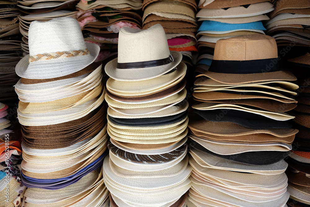 Vintage stacked straw hats in local souvenir shop in Thailand