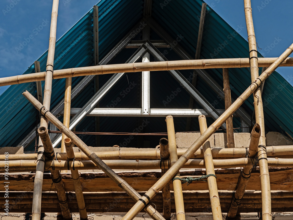 Asian bamboo scaffolding in a village area Asian bamboo scaffolding in a village area