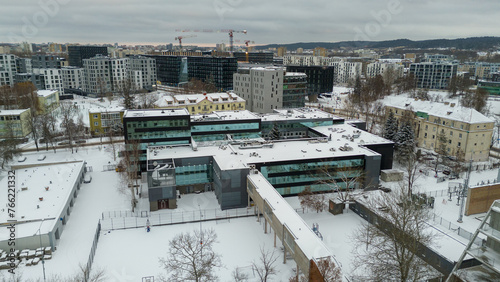 Drone photography of winter cityscape covered by snow during winter day