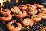 Close up of grilling shrimps on a fire colorful background