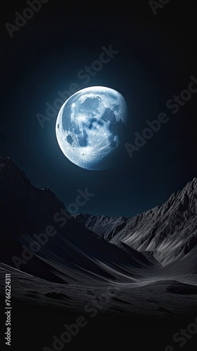 A large moon is in the sky above a mountain range. The moon is the main focus of the image, and the mountains in the background create a sense of depth and scale