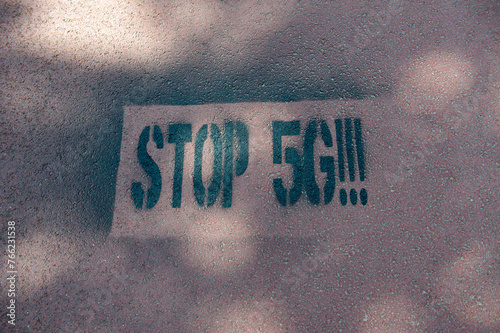 Amsterdam The Netherlands May 2020. “Stop 5G” spray painted onto a cycle path. Some see 5G networks as a health risk with some attributing the corona virus outbreak to it. photo