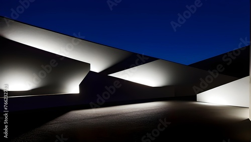 Modern architecture at night with illuminated facade and geometric shapes against a dark sky.