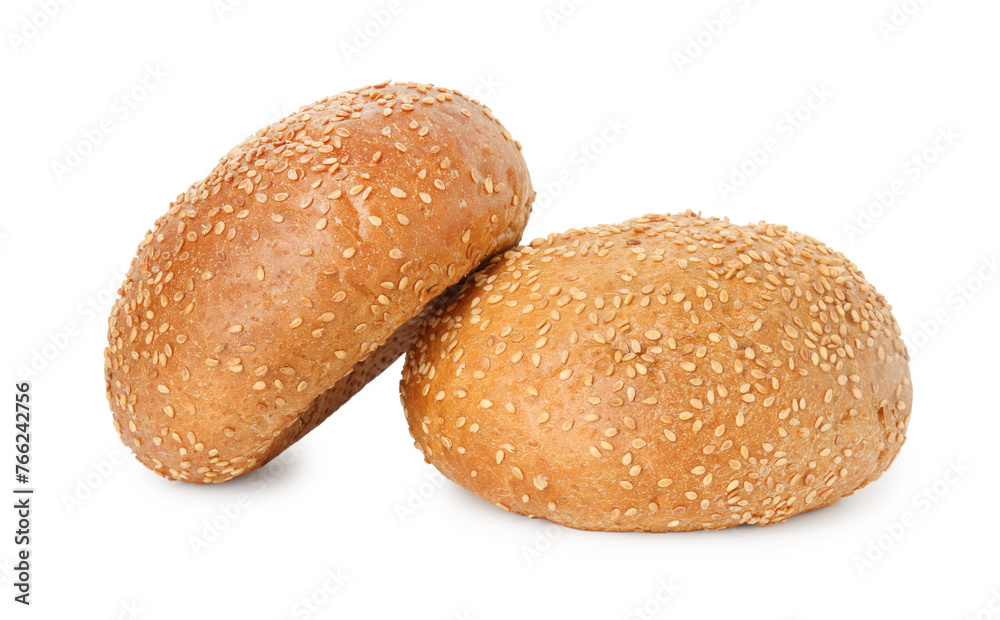 Two fresh hamburger buns with sesame seeds isolated on white Two fresh hamburger buns with sesame seeds isolated on white