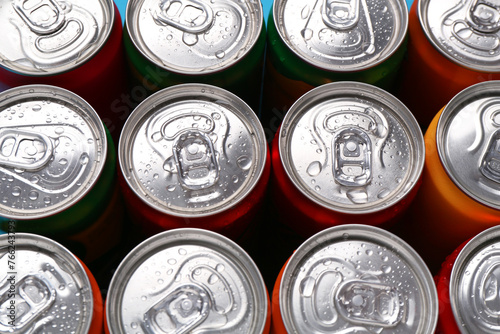 Energy drinks in wet cans, above view. Functional beverage