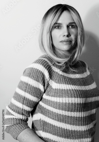 Portrait of a beautiful woman in a sweater - black and white photo