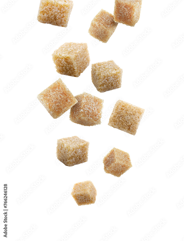 Brown cane sugar cubes falling on white background Brown cane sugar cubes falling on white background