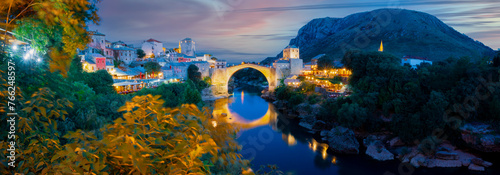 Mostar, Bosnia and Herzegovina. The Old Bridge, Stari Most, with emerald river Neretva. photo