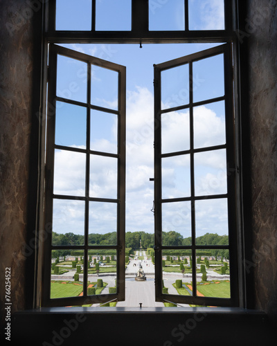Looking at the royal gardens through the windows in Drottningholm palace in Stockholm  Sweden