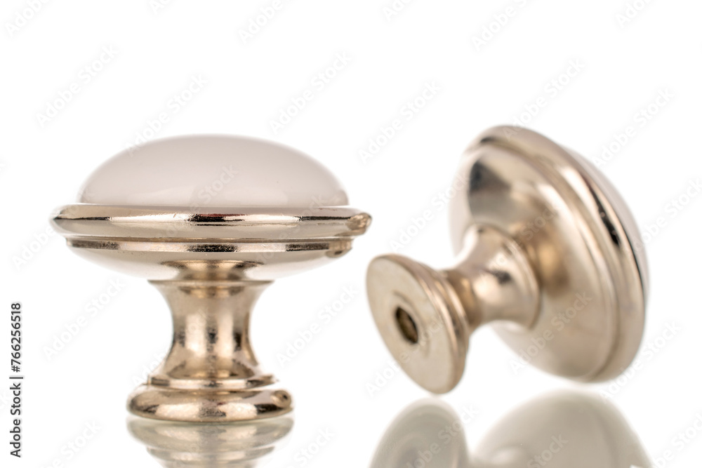 Two metal handles for furniture, macro, isolated on white background. Two metal handles for furniture, macro, isolated on white background.