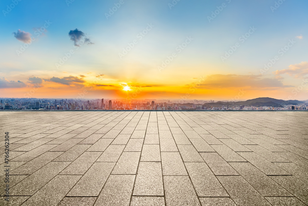 Empty square floor and modern city skyline with mountains