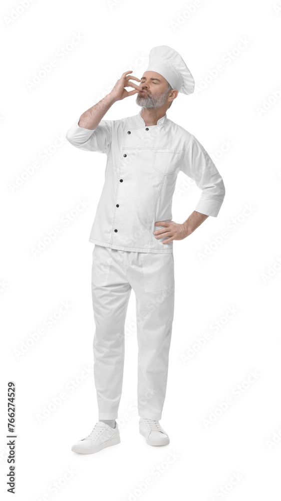 Chef in uniform showing perfect sign on white background Chef in uniform showing perfect sign on white background