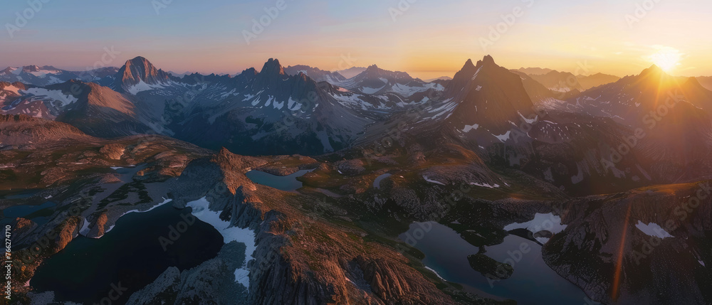 A panoramic view of the towering mountains and snowcapped peaks in Frenchman Lake