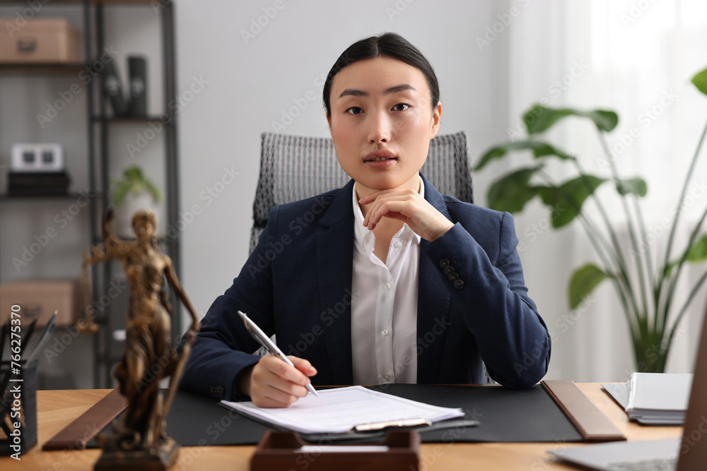 Portrait of notary at table in office Portrait of notary at table in office