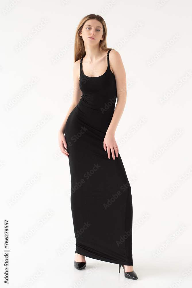 Snap Models. Full length portrait of a beautiful brunette woman in black bikini isolated on white background Snap Models. Full length portrait of a beautiful brunette woman in black bikini isolated on white background