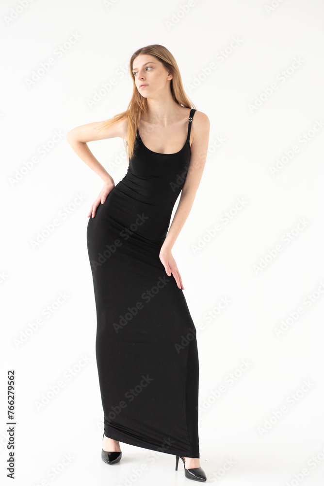 Snap Models. Full length portrait of a beautiful brunette woman in black bikini isolated on white background Snap Models. Full length portrait of a beautiful brunette woman in black bikini isolated on white background