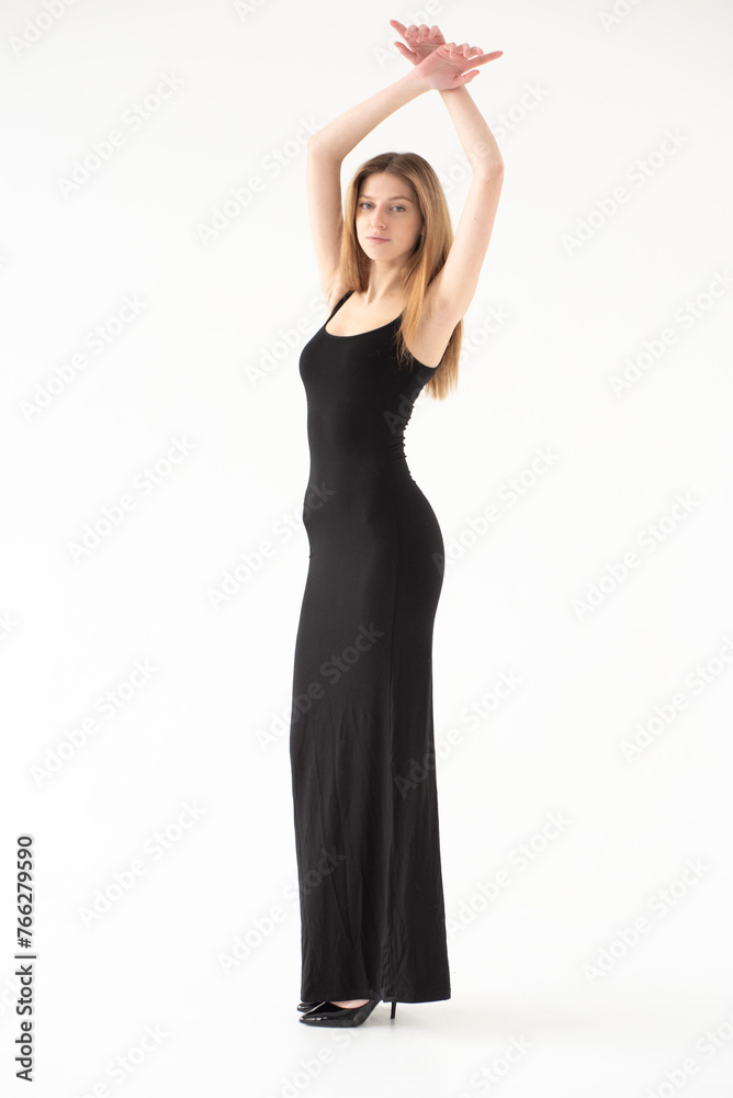 Naklejka premium Snap Models. Full length portrait of a beautiful brunette woman in black bikini isolated on white background