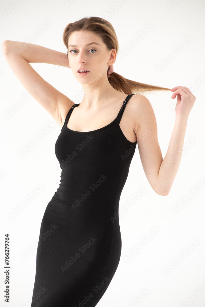 Snap Models. Full length portrait of a beautiful brunette woman in black bikini isolated on white background Snap Models. Full length portrait of a beautiful brunette woman in black bikini isolated on white background