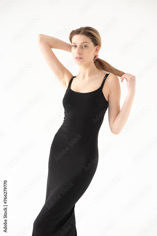 Snap Models. Full length portrait of a beautiful brunette woman in black bikini isolated on white background Snap Models. Full length portrait of a beautiful brunette woman in black bikini isolated on white background