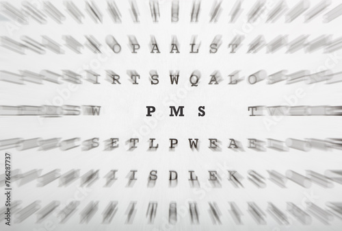 PMS abbreviation in crossword letters with motion focus effect