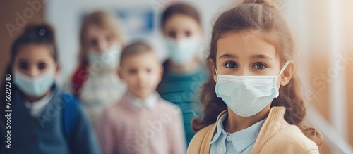 A group of children wearing face masks in a classroom, practicing art for fun and leisure. Each childs eyelashes move as they work on their creative event, with water and ear safety in mind