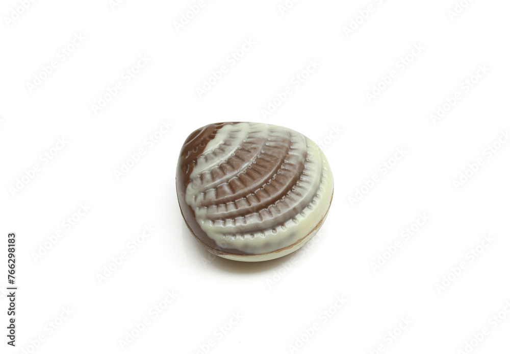 Chocolate praline shaped like seashell isolated on white background Chocolate praline shaped like seashell isolated on white background