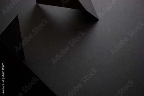 Black on black 3d geometric background, copy space