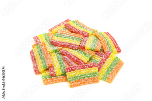 Pile of sugar sprinkled rainbow sour gummy candies isolated on white background