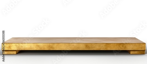 A close-up view of a luxurious gold coffee table  set against a plain white background