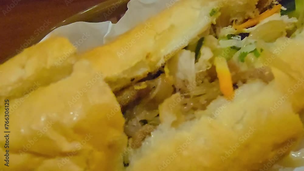 Sandwich Banh mi, vietnamese baguette with grilled chicken and mixed salad, vietnamese sandwich