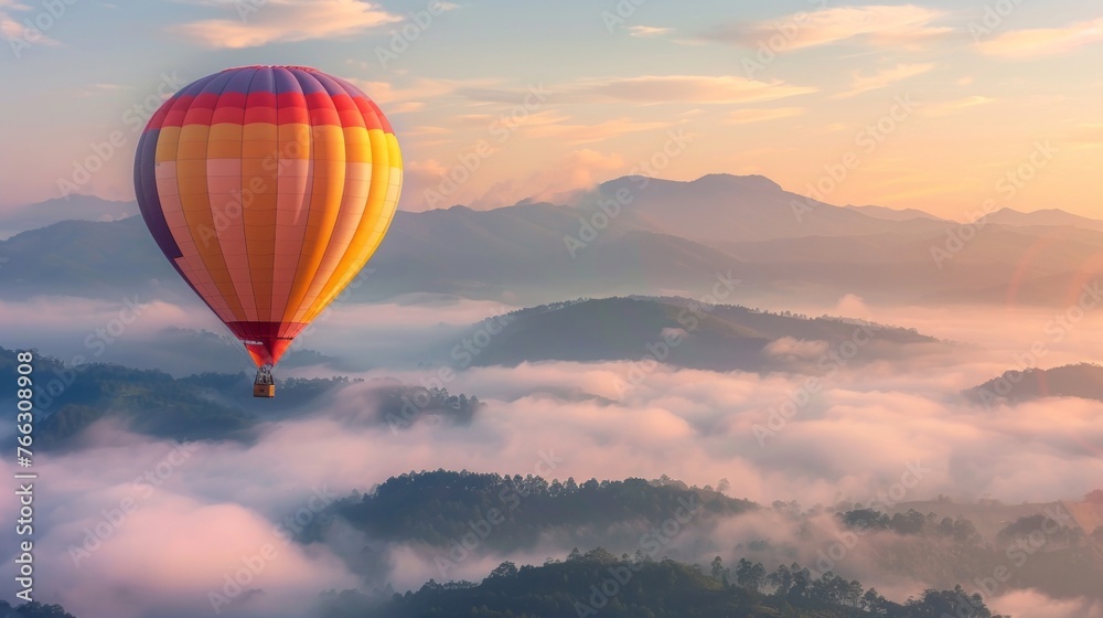 Hot Air Balloon Over Misty Mountains at Sunrise