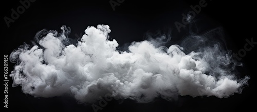 Thick smoke is swirling in the dark air against a black background, creating a mysterious and atmospheric effect