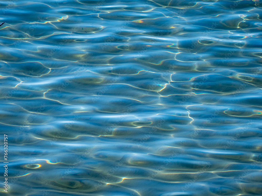 Water surface in the bay of Ogliastro Marina in Italy.