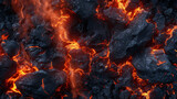 A close up of a black rock with orange flames coming out of it