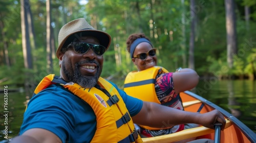 Happy couple enjoying themselves on a lake, rowing a boat