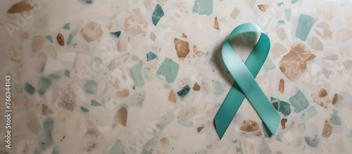 Teal green cancer ribbon terrazzo background support female ovarian campaign cervical ptsd sexual assault polycystic ovary syndrome PCOS anxiety survivor research copy space header medicine banner