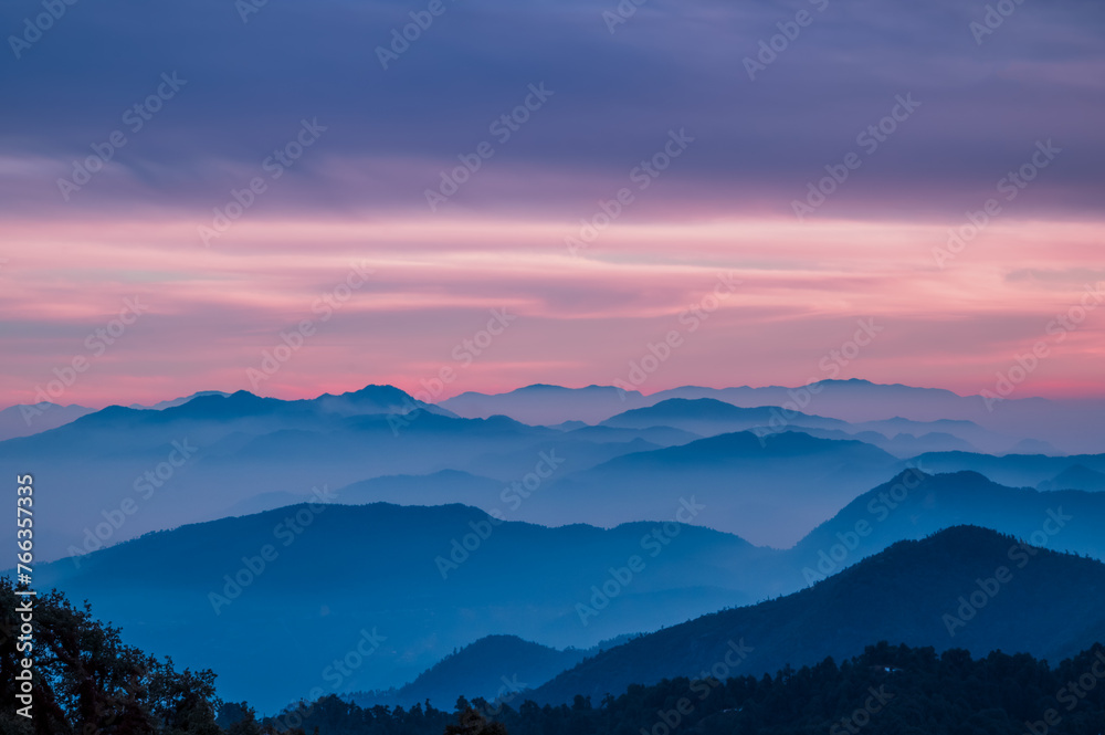Sunset in the mountains. Dawn Majesty: High-Resolution Mountains with Soothing Natural Colors and Majestic Texture. Scenic views of Himalayan ranges of Kumaun region, Uttarakhand, India. 