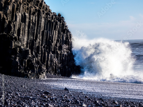 Waves crashing against basaltic rocks on Reynisfjara beach