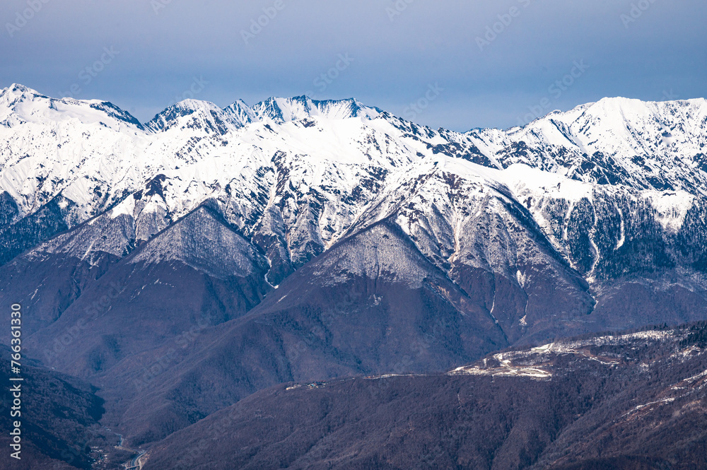 peaks of snow-capped mountains in winter