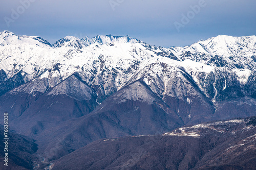 peaks of snow-capped mountains in winter © dbrus