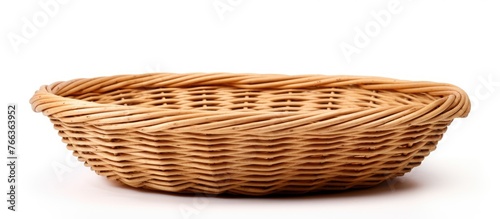 Wicker basket in close-up view against a plain white background, showcasing its intricate weave and texture