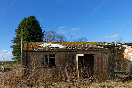 Part of the Airfield buildings still left standing but in disrepair at the old Wartime Airfield of Stracathro on a bright Spring morning in March.