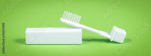 Simple toothbrush, isolated on green