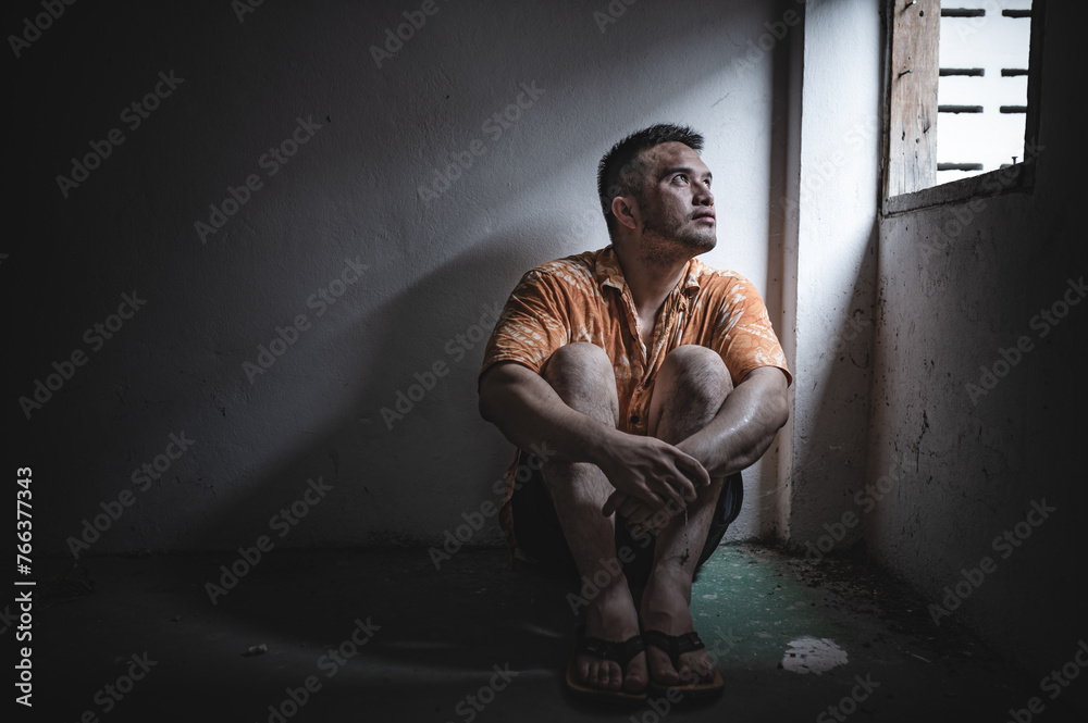 Asian man addict drug in the deserted place,A junkie feels alone in this world,Sad young man sitting in the corner of the room,People are stressed and have depression Asian man addict drug in the deserted place,A junkie feels alone in this world,Sad young man sitting in the corner of the room,People are stressed and have depression