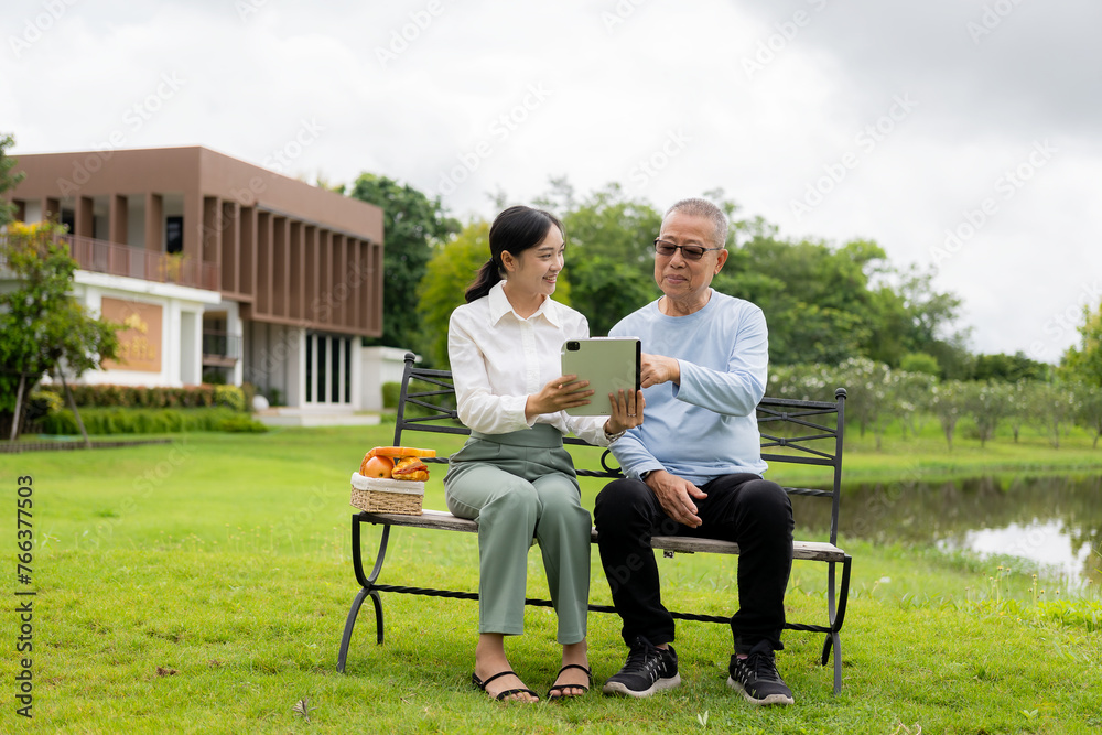 Asian nurse caring for an old man in the garden at home, nurse caregiver supporting health insurance at home or hospital, elderly man Asian nurse caring for an old man in the garden at home, nurse caregiver supporting health insurance at home or hospital, elderly man