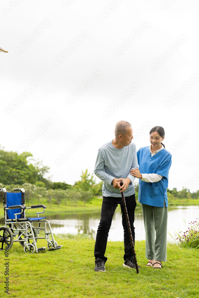 Fototapeta premium Asian nurse caring for an old man in the garden at home, nurse caregiver supporting health insurance at home or hospital, elderly man