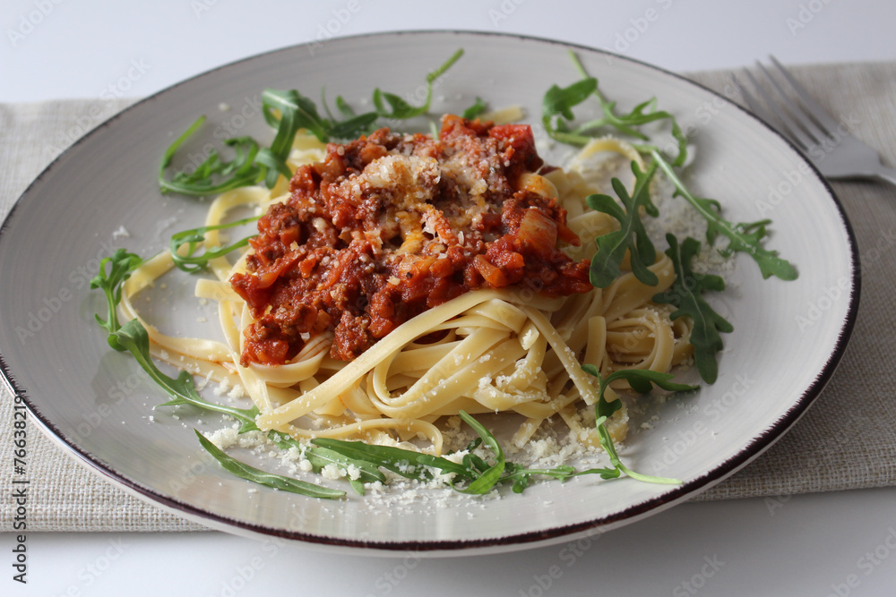 Traditional Bolognese Linguine with Shaved Parmesan and Fresh Arugula
Traditional Bolognese Linguine with Shaved Parmesan and Fresh Arugula