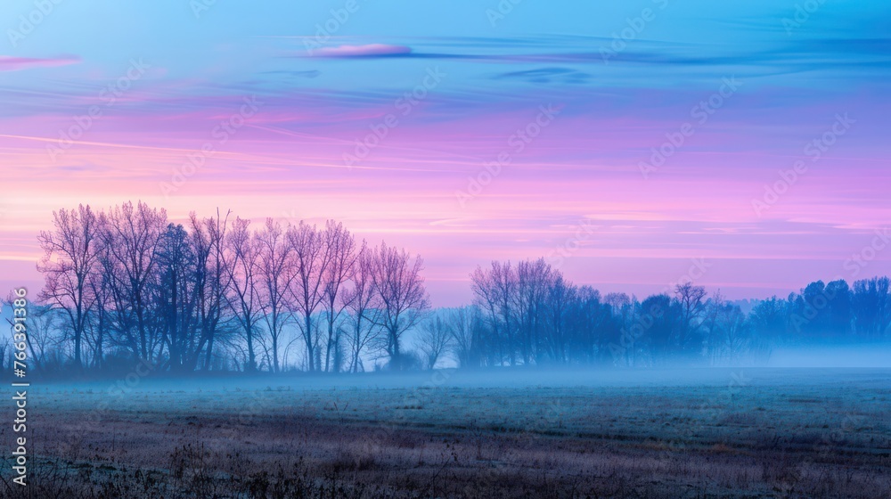 Fototapeta premium Before sunrise, a beautiful spring morning is captured during the blue hour.